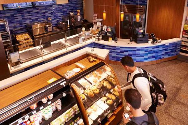 Students browsing food options inside Seidman Cafe